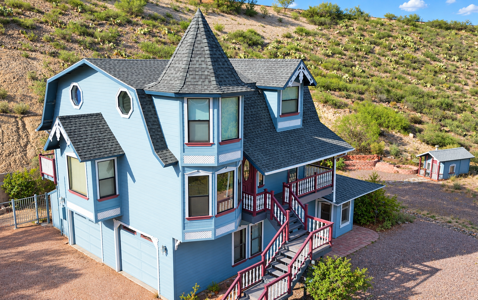 Achmed’s blue house office in Camp Verde, nestled against the desert hillside